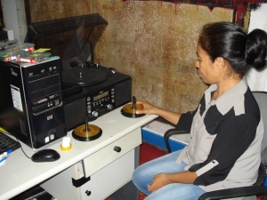 CAVR Archives staff digitising audiocassettes.